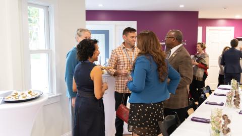 several people chat during a gathering